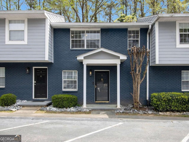 3149 Buford Hwy NE Unit 3, Brookhaven, GA 30329 - view of front facade with uncovered parking and brick siding