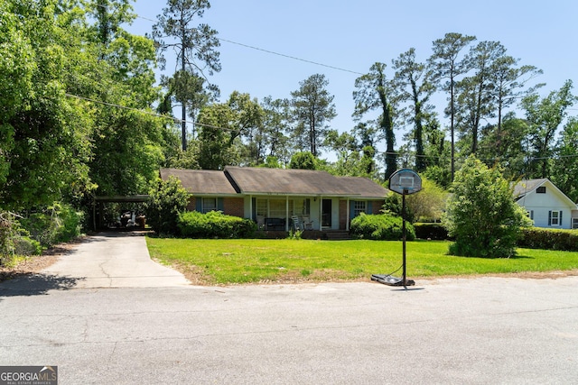 202 Pine St, Quitman, GA 31643 - ranch-style home with driveway, a front yard, a porch, and an attached carport