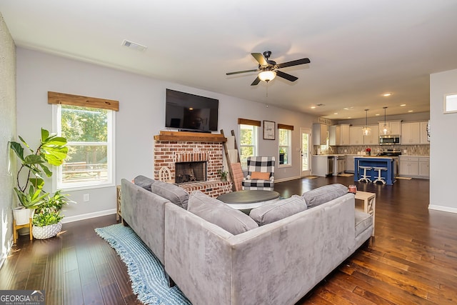 979 Rowe Rd, Senoia, GA 30276 - living room with baseboards, a fireplace, ceiling fan, healthy amount of natural light, and recessed lighting