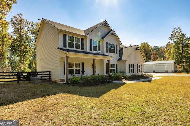 979 Rowe Rd, Senoia, GA 30276 - view of front of property featuring board and batten siding, an outbuilding, a porch, and roof with shingles