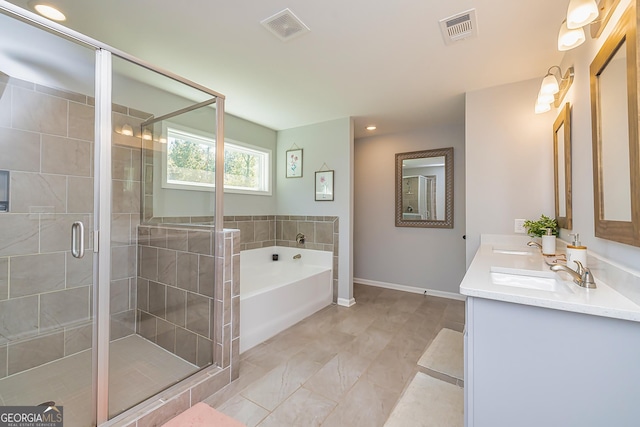 979 Rowe Rd, Senoia, GA 30276 - bathroom featuring a bath, double vanity, a shower stall, baseboards, and recessed lighting
