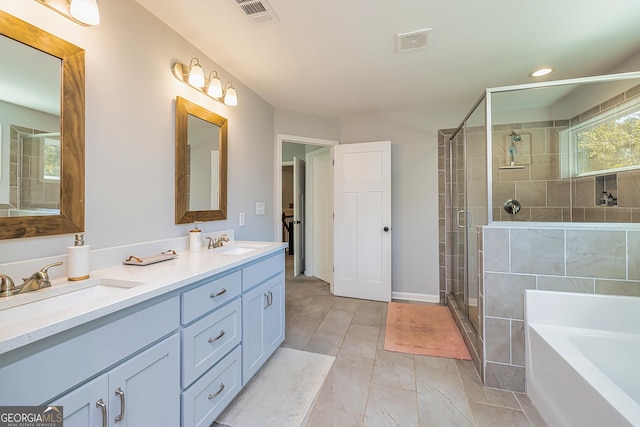 979 Rowe Rd, Senoia, GA 30276 - bathroom featuring double vanity, a stall shower, a garden tub, and recessed lighting