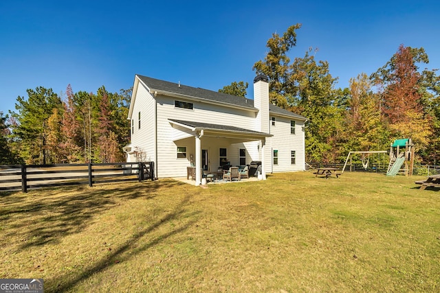 979 Rowe Rd, Senoia, GA 30276 - rear view of property with a playground, a chimney, a patio, and an outdoor living space