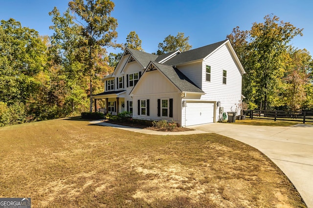 979 Rowe Rd, Senoia, GA 30276 - view of front of house featuring driveway, an attached garage, roof with shingles, and board and batten siding