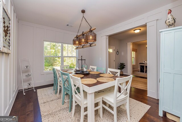 979 Rowe Rd, Senoia, GA 30276 - dining room with a decorative wall and dark wood finished floors