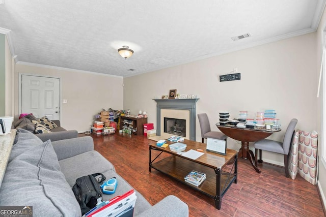 850 Long Branch Cir, Sugar Hill, GA 30518 - living room featuring crown molding, wood finished floors, a fireplace with flush hearth, and baseboards