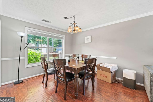 850 Long Branch Cir, Sugar Hill, GA 30518 - dining room with a chandelier, crown molding, wood finished floors, a textured ceiling, and baseboards