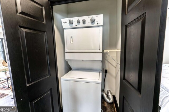 1764 Spring Ave, East Point, GA 30344 - washroom featuring estacked washer and dryer and wood finished floors