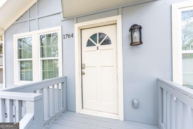 1764 Spring Ave, East Point, GA 30344 - view of exterior entry featuring stucco siding and a porch