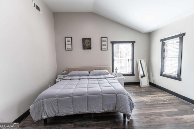 1764 Spring Ave, East Point, GA 30344 - bedroom featuring lofted ceiling and wood finished floors