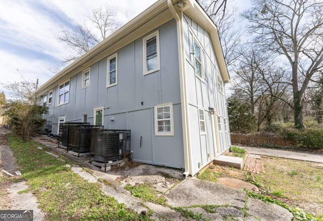 1764 Spring Ave, East Point, GA 30344 - view of side of property featuring board and batten siding and a cooling unit
