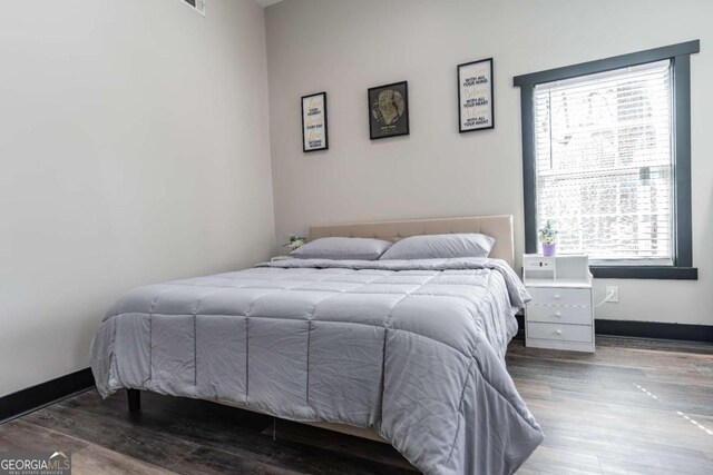 1764 Spring Ave, East Point, GA 30344 - bedroom with multiple windows and wood finished floors