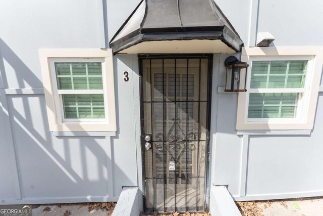 1764 Spring Ave, East Point, GA 30344 - doorway to property featuring stucco siding