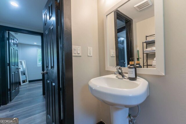 1764 Spring Ave, East Point, GA 30344 - bathroom featuring wood finished floors and a sink