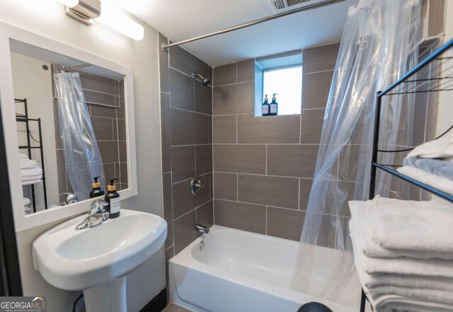 1764 Spring Ave, East Point, GA 30344 - bathroom with shower / bath combination with curtain and a sink