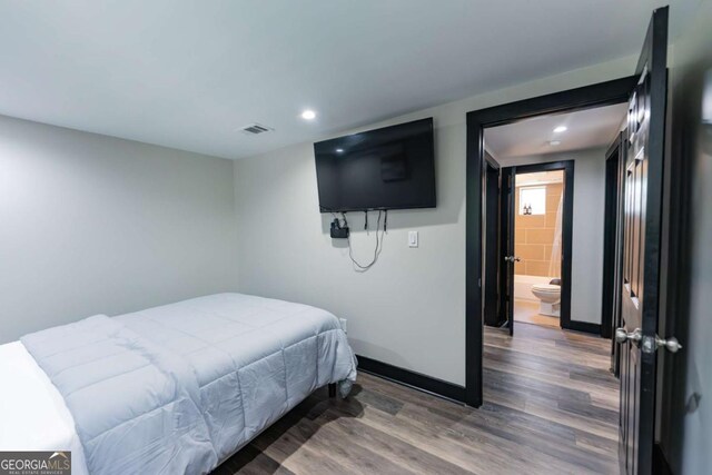 1764 Spring Ave, East Point, GA 30344 - bedroom with wood finished floors, recessed lighting, and connected bathroom