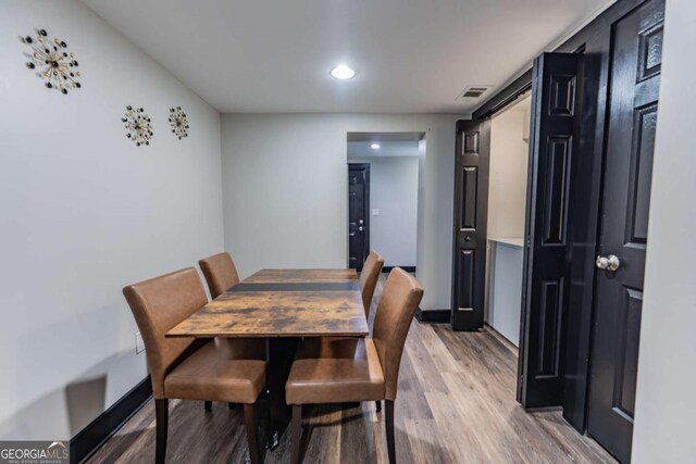 1764 Spring Ave, East Point, GA 30344 - dining area featuring light wood-type flooring and recessed lighting