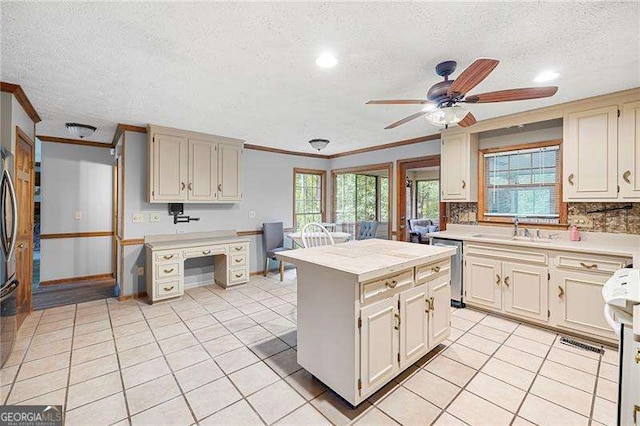 2041 Millspring Way NW, Kennesaw, GA 30152 - kitchen featuring a sink, ornamental molding, dishwasher, light countertops, and a textured ceiling