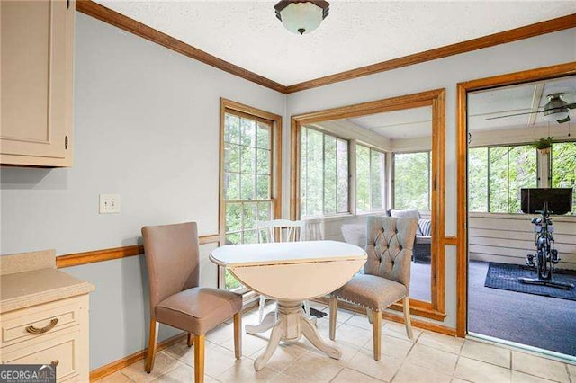 2041 Millspring Way NW, Kennesaw, GA 30152 - dining space featuring healthy amount of natural light, ornamental molding, a textured ceiling, light tile patterned flooring, and baseboards