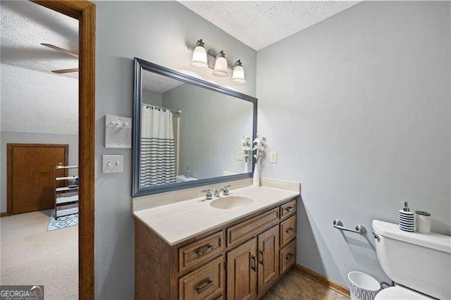 2041 Millspring Way NW, Kennesaw, GA 30152 - bathroom with a textured ceiling, toilet, vanity, a ceiling fan, and a shower with curtain