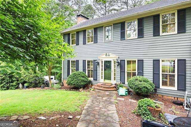 2041 Millspring Way NW, Kennesaw, GA 30152 - colonial home featuring a chimney and a front lawn