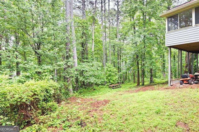 2041 Millspring Way NW, Kennesaw, GA 30152 - view of green lawn featuring a forest view and a sunroom