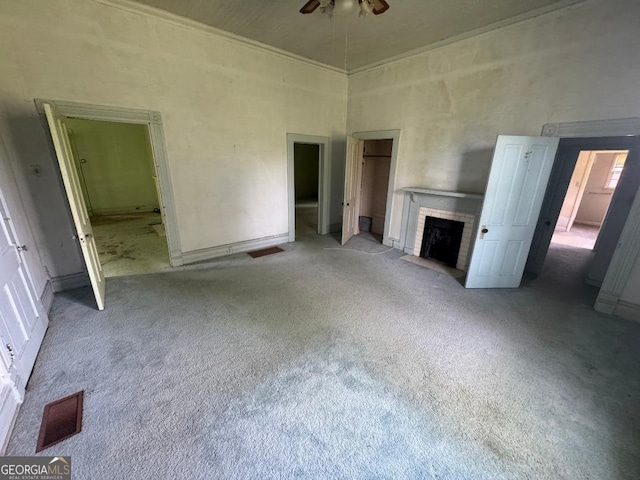 7782 Church St, Bartow, GA 30413 - unfurnished living room with a ceiling fan, carpet, a high ceiling, a brick fireplace, and ornamental molding