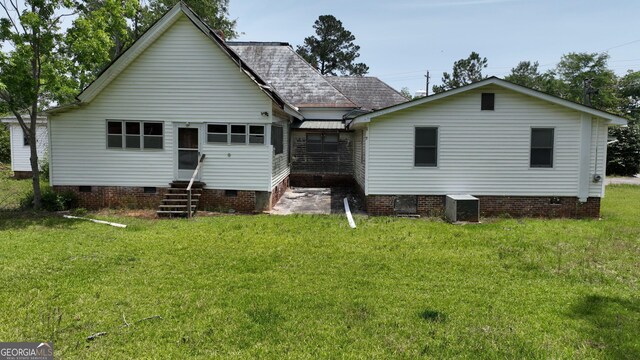 7782 Church St, Bartow, GA 30413 - rear view of property with crawl space, entry steps, a lawn, central air condition unit, and a shingled roof