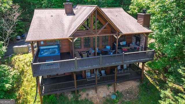 437 Spruce Cir Unit G, Mineral Bluff, GA 30559 - back of property with a chimney, a deck, and log veneer siding
