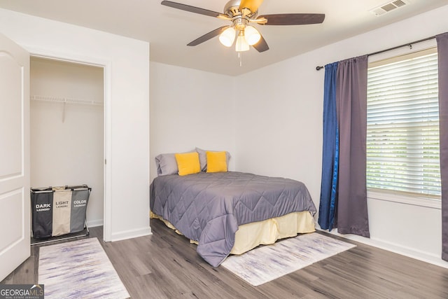 2689 Muskeg Ct SW, South Fulton, GA 30331 - bedroom with wood finished floors, baseboards, a closet, and a ceiling fan