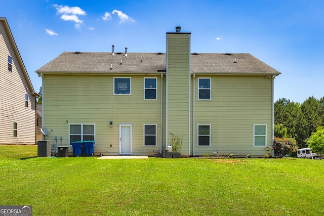 2689 Muskeg Ct SW, South Fulton, GA 30331 - rear view of property with a chimney and a yard