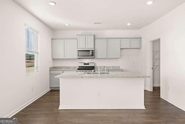 170 Aster Ave, Locust Grove, GA 30248 - kitchen with stainless steel appliances, a sink, a center island with sink, gray cabinets, and recessed lighting