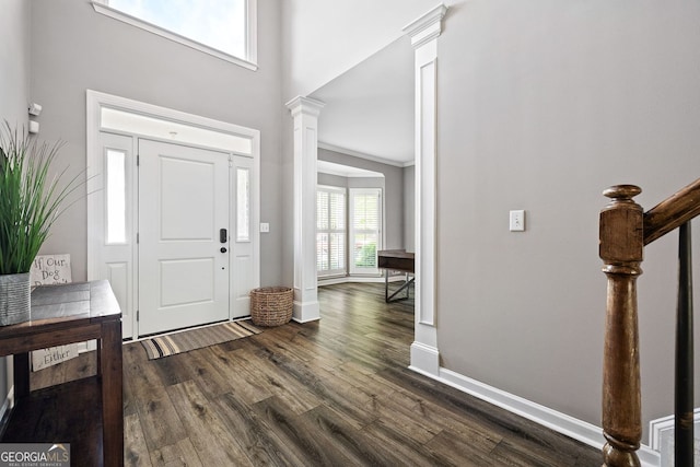 4527 Village Springs Run, Dunwoody, GA 30338 - entrance foyer with decorative columns, dark wood-type flooring, baseboards, and a towering ceiling