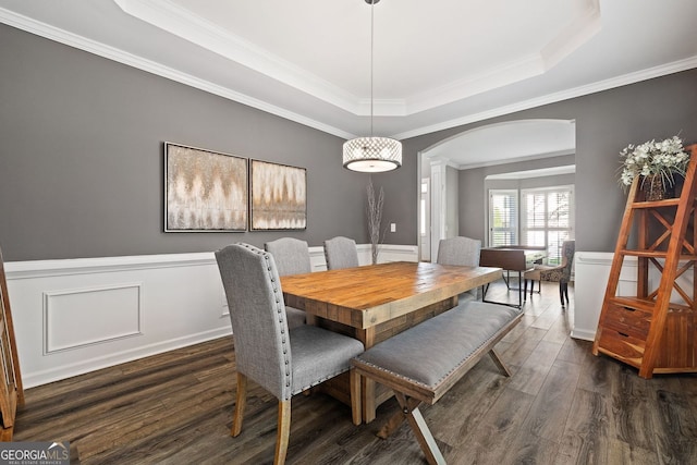 4527 Village Springs Run, Dunwoody, GA 30338 - dining area with arched walkways, a tray ceiling, dark wood-style flooring, ornamental molding, and a wainscoted wall
