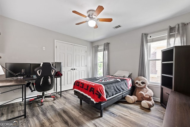 4527 Village Springs Run, Dunwoody, GA 30338 - bedroom featuring wood finished floors, a closet, and ceiling fan