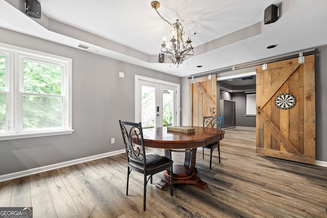 4527 Village Springs Run, Dunwoody, GA 30338 - dining area with wood finished floors, baseboards, french doors, a chandelier, and plenty of natural light
