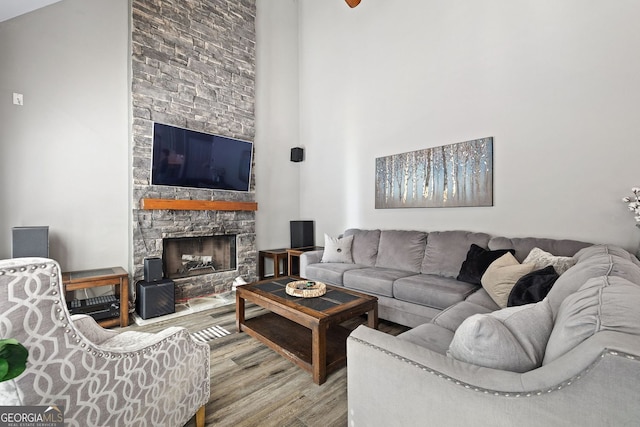 4527 Village Springs Run, Dunwoody, GA 30338 - living room featuring wood finished floors, a fireplace, and a high ceiling