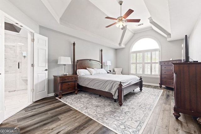 4527 Village Springs Run, Dunwoody, GA 30338 - bedroom with vaulted ceiling, wood finished floors, ceiling fan, ensuite bath, and baseboards
