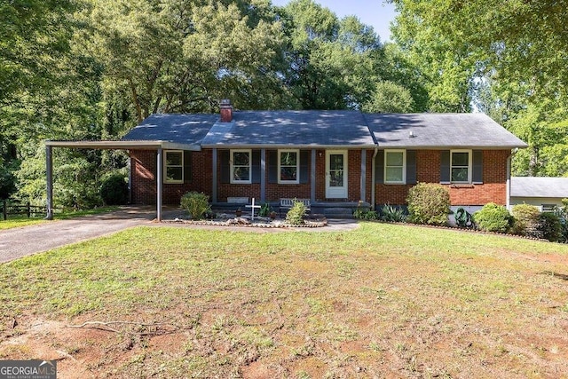 4370 Tradition Ter, Austell, GA 30106 - ranch-style house with asphalt driveway, brick siding, a front lawn, an attached carport, and covered porch