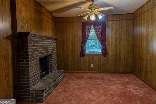 4370 Tradition Ter, Austell, GA 30106 - unfurnished living room with a ceiling fan, carpet floors, wooden walls, and a brick fireplace
