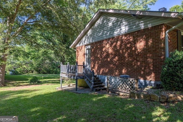 4370 Tradition Ter, Austell, GA 30106 - view of side of home featuring a lawn, brick siding, a wooden deck, and stairway