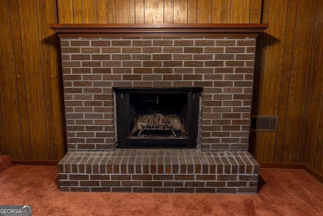 4370 Tradition Ter, Austell, GA 30106 - detailed view of wood walls, carpet flooring, and a fireplace