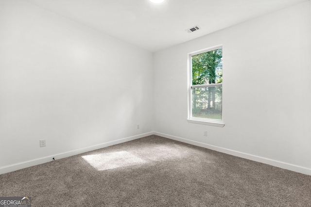 8544 Plumtree Dr, Riverdale, GA 30274 - carpeted empty room with baseboards