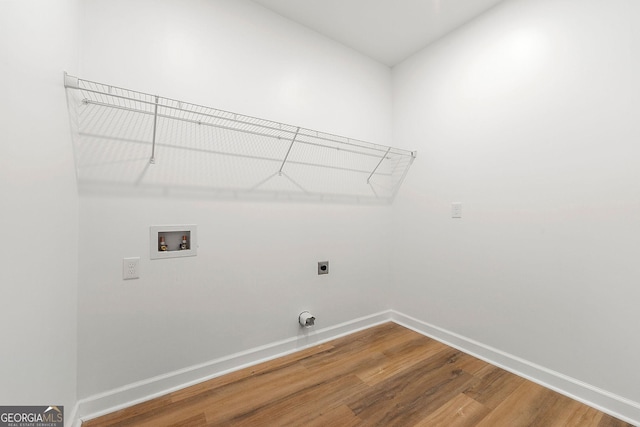 8544 Plumtree Dr, Riverdale, GA 30274 - washroom featuring hookup for an electric dryer, hookup for a washing machine, baseboards, and wood finished floors