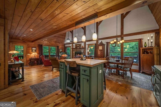 744 Dover Falls Trl, Ellijay, GA 30540 - kitchen featuring green cabinetry, a chandelier, wood-type flooring, plenty of natural light, and wooden ceiling with exposed beams