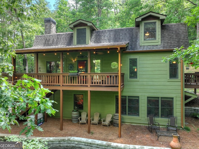 744 Dover Falls Trl, Ellijay, GA 30540 - back of house featuring roof with shingles, a patio, a chimney, and a deck