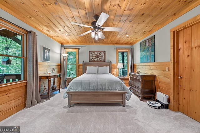744 Dover Falls Trl, Ellijay, GA 30540 - carpeted bedroom with wood ceiling, multiple windows, wooden walls, and ceiling fan