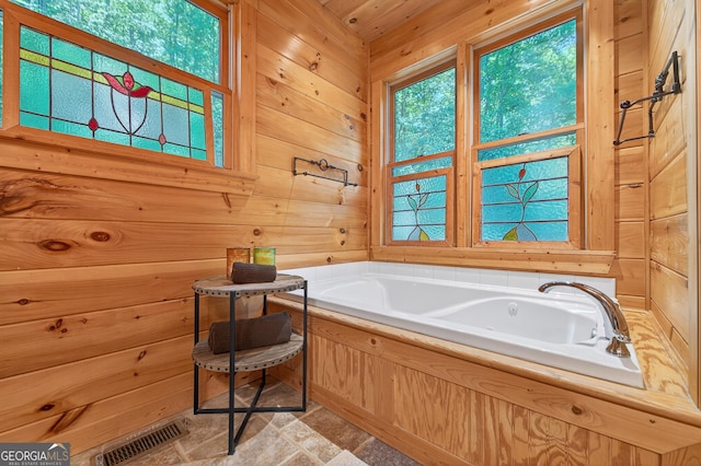 744 Dover Falls Trl, Ellijay, GA 30540 - bathroom featuring wood walls and a jetted tub