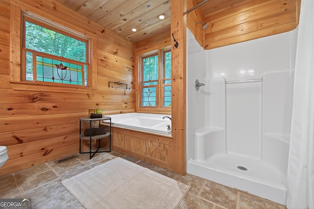 744 Dover Falls Trl, Ellijay, GA 30540 - bathroom with wood walls, a garden tub, a shower with curtain, recessed lighting, and stone finish flooring