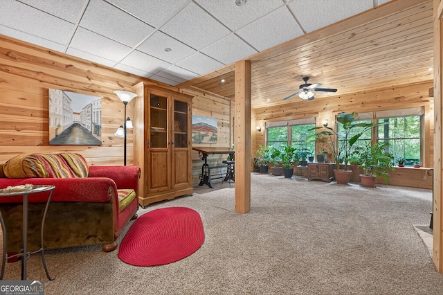 744 Dover Falls Trl, Ellijay, GA 30540 - living room with wooden walls, carpet floors, and ceiling fan